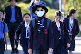 School student in face mask.