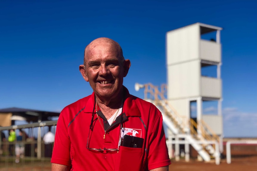 John Biggs standing in front of racing tower at Meekatharra Cup