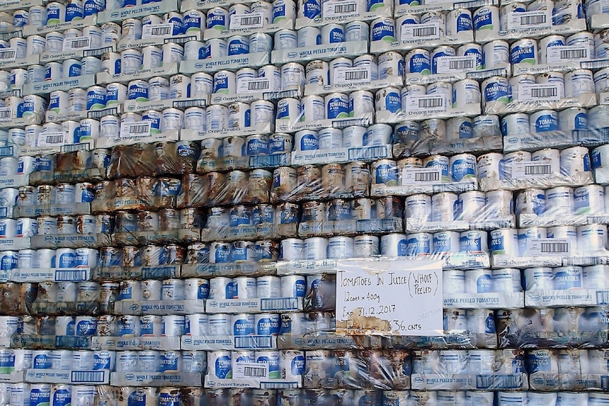 Stacks of tinned tomatoes sent as donations to disaster zones