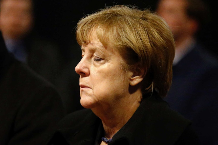 Angela Merkel closes her eyes in Berlin