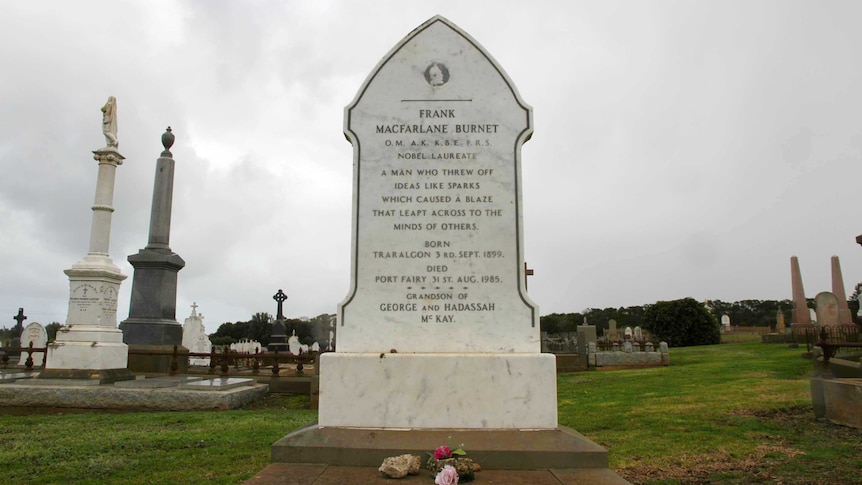 The a tall white marble gravestone bearing the name Frank MacFarlane Burnet