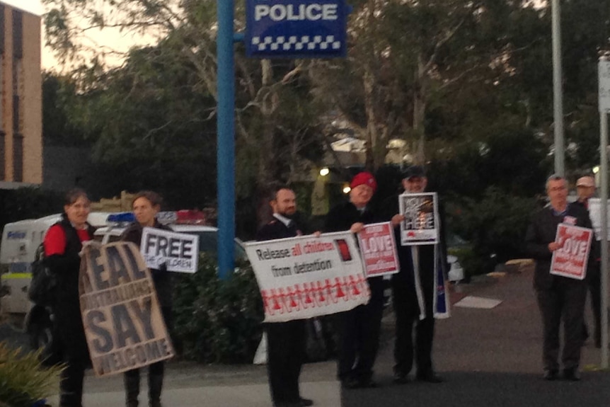 Protesters await the release of their companions