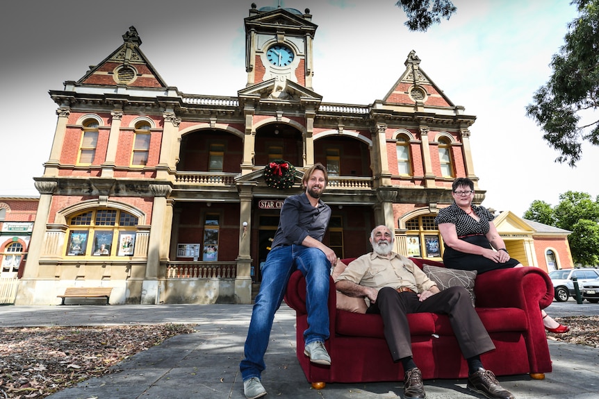 The Star Cinema with Business Manager Martin Myles, actor John Flaus and board chair Fiona McMahon sitting on a couch out front.