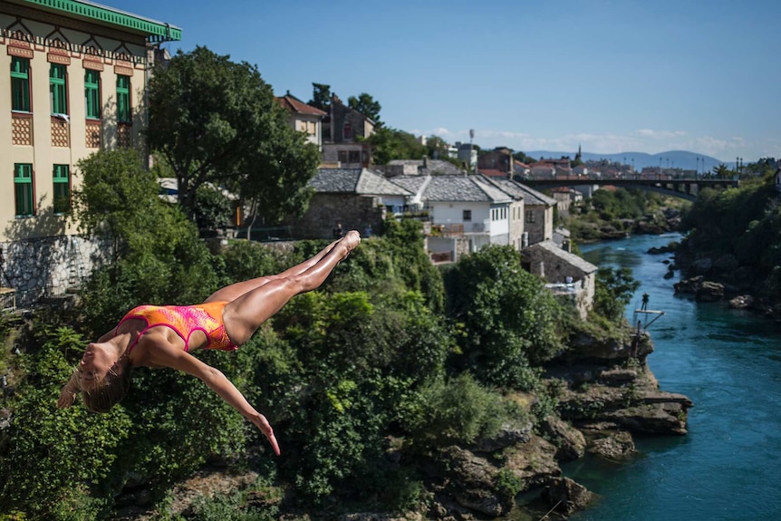 Helena Merten executes a 21.5-metre dive off Stari Most Bridge in Mostar, Bosnia and Herzegovina.