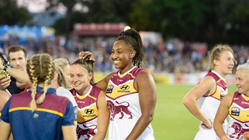 Sabrina Frederick-Traub of the Lions (C) celebrates after Brisbane's AFLW win over Adelaide.