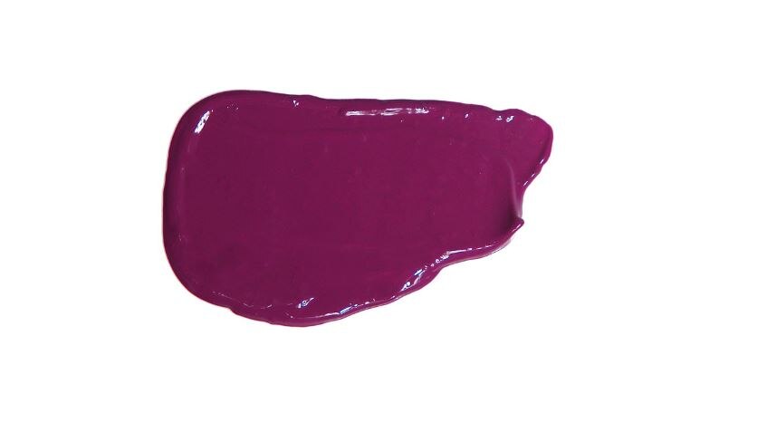 Photo of a smudge of purple makeup on a white background 