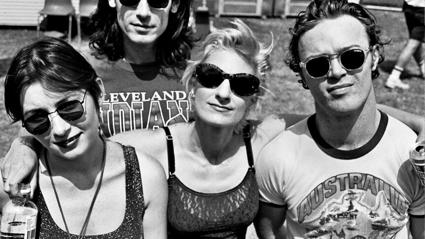 A black-and-white photo of four people posing for a photo at the 1992 Big Day Out.