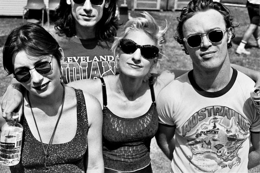 A black-and-white photo of four people posing for a photo at the 1992 Big Day Out.