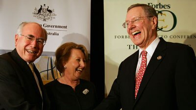 Steve Forbes shakes hands with Prime Minister John Howard