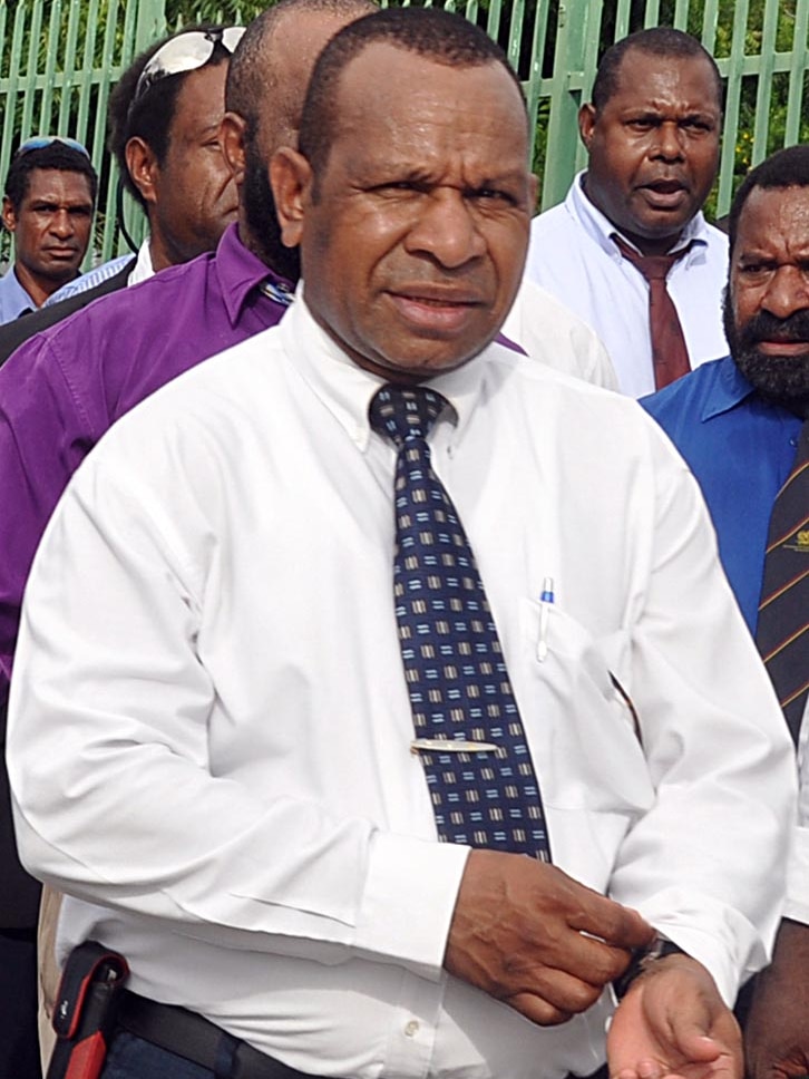 PNG politician Belden Namah walks to Government House in Port Moresby.