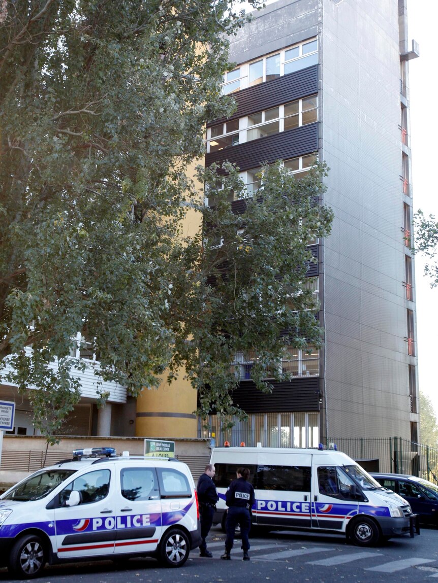 French police stand in front of the offices of the French satirical weekly, Charlie Hebdo.