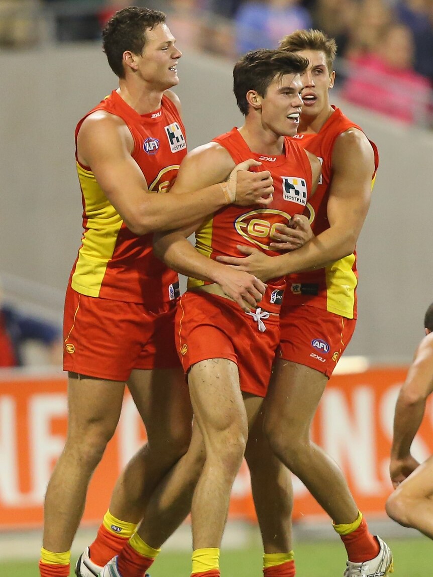 Setting an example ... Jaeger O'Meara (C) celebrates with team-mates after kicking his goal