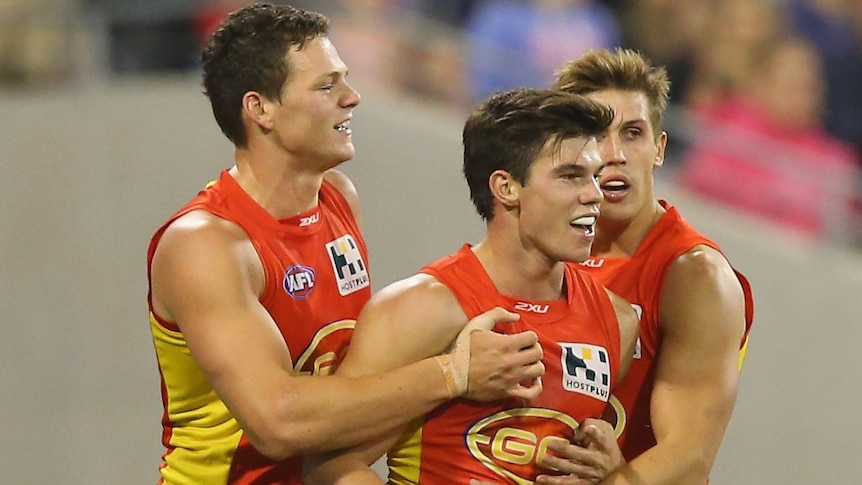 Setting an example ... Jaeger O'Meara (C) celebrates with team-mates after kicking his goal