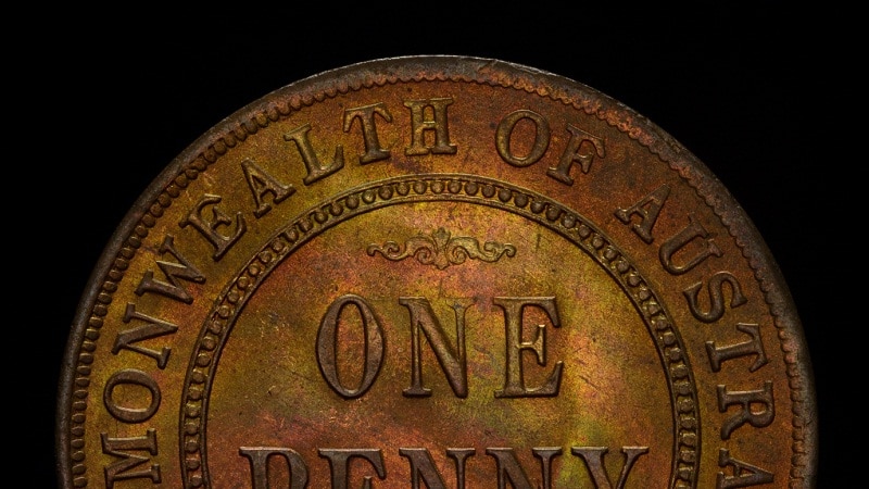 The face of  bronze-coloured coin with Commonwealth of Australia, one penny and 1920 on it is shown against a black background.