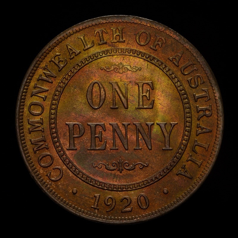 The face of  bronze-coloured coin with Commonwealth of Australia, one penny and 1920 on it is shown against a black background.