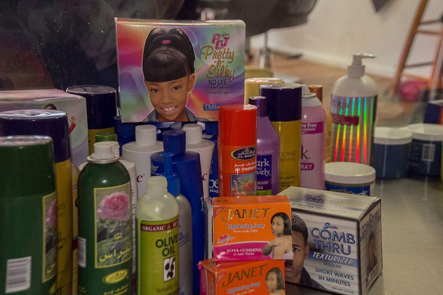 Display of African hair and skin products in a glass shop cabinet