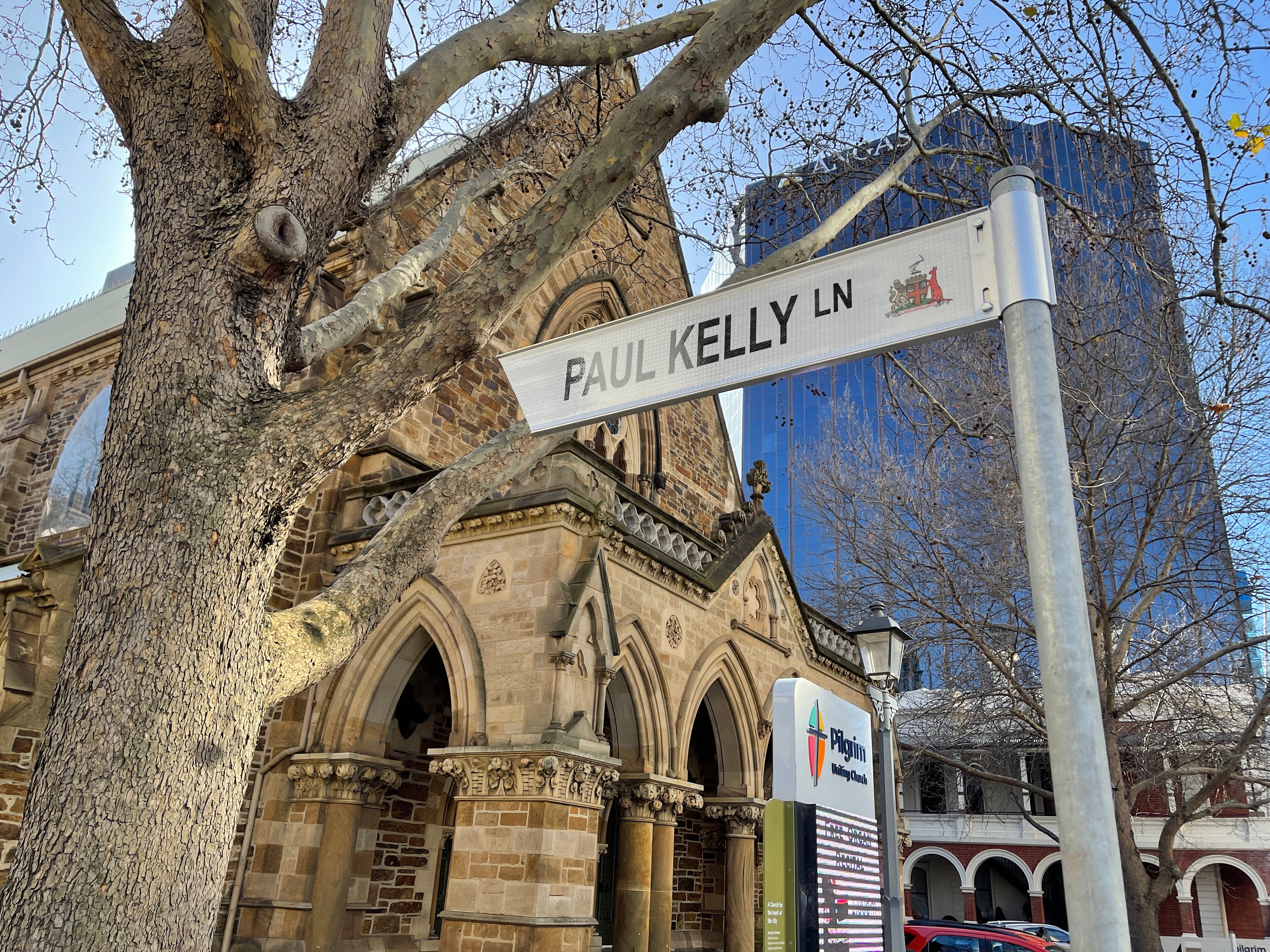 A street sign that says Paul Kelly Lane