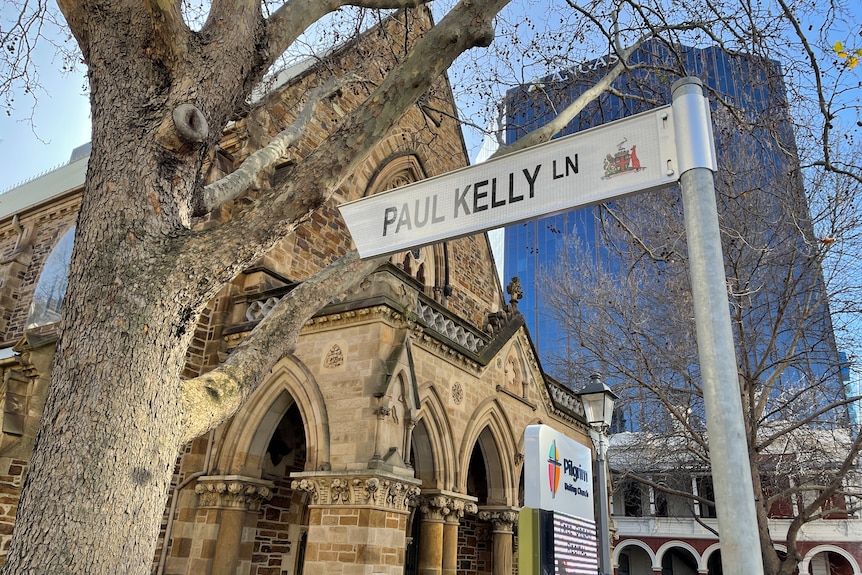 A street sign that says Paul Kelly Lane