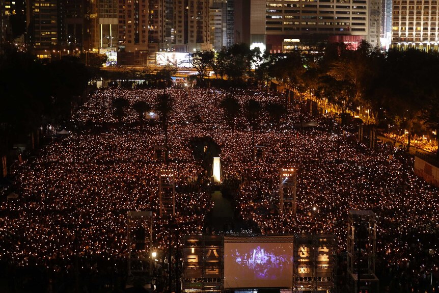 A birds eye view of thousands of candles lit in a vigil in Hong Kong.