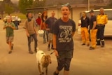 A woman walking a goat yells at the Prime Minister in Cobargo