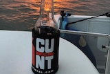 A beer bottle in a CU in the NT stubby holder