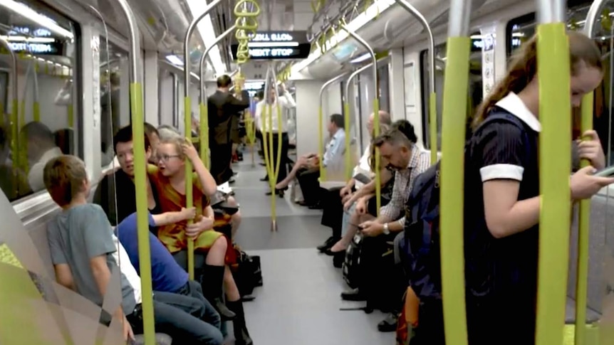 People sitting inside a carriage.