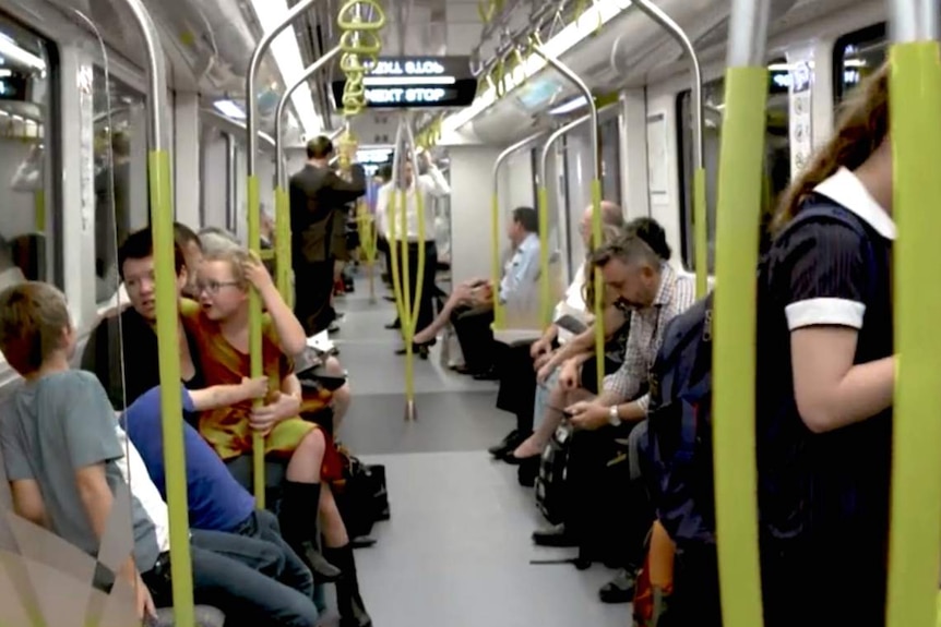 People sitting inside a carriage.