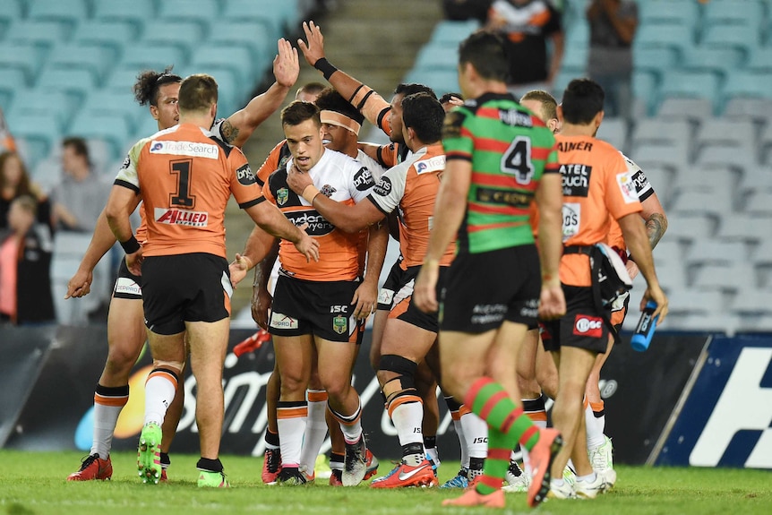 Wests Tigers celebrate a try against South Sydney