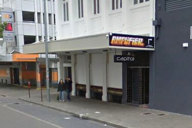 A wide shot of the exterior of the Amplifier Bar on Murray Street in Perth with two people walking past.