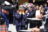ACT firefighter David Balfour's coffin is carried away