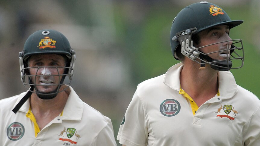 Hussey and Marsh leave the field