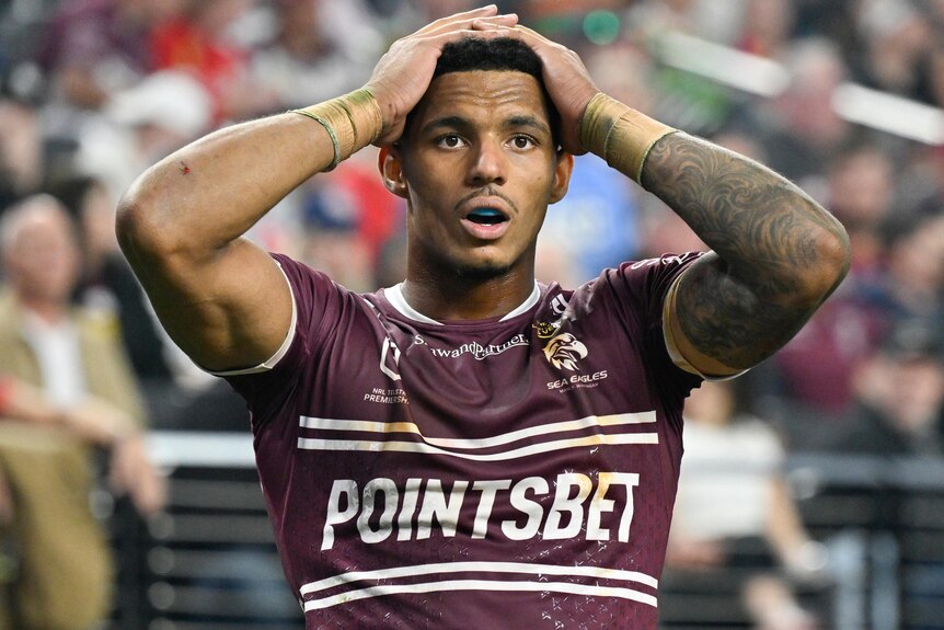 Jason Saab with both his hands on his head during Manly's Las Vegas NRL match against South Sydney.
