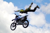 Daredevil motorcross rider Tyrone Gilks performs a stunt