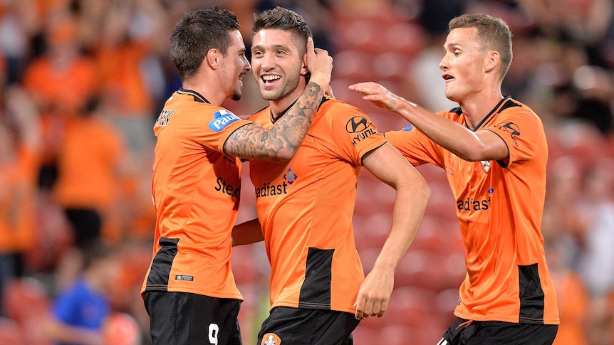 Brisbane's Brandon Borrello is congratulated by team-mates after his goal against Adelaide.