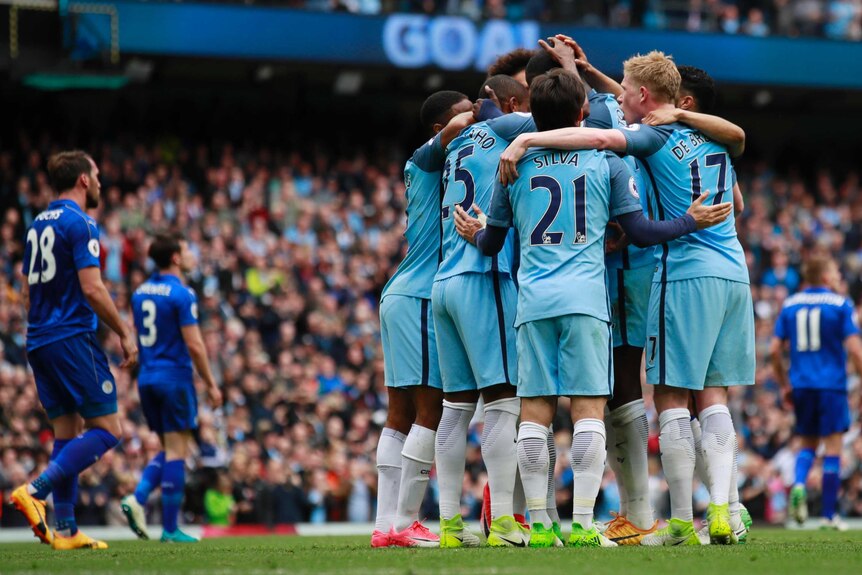 Manchester City celebrates scoring its second goal in the win against Leicester City.