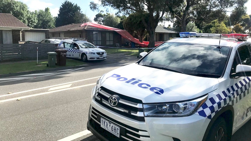 Police parked outside a house where a teenager was hit by a metal pole.