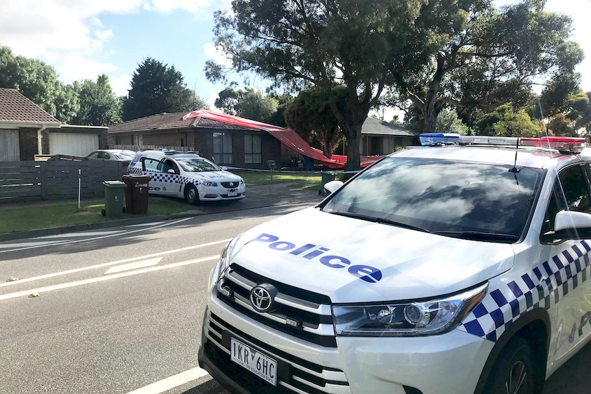 Police parked outside a house where a teenager was hit by a metal pole.