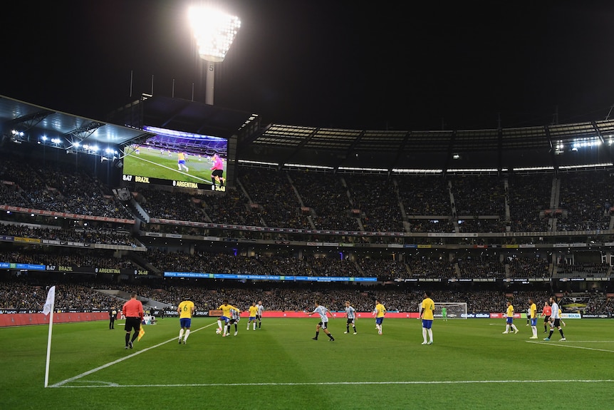 A general view of the MCG at night with a configuration for association football