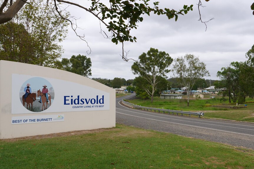 A sign by the side of a road reading 'Eidsvold' 