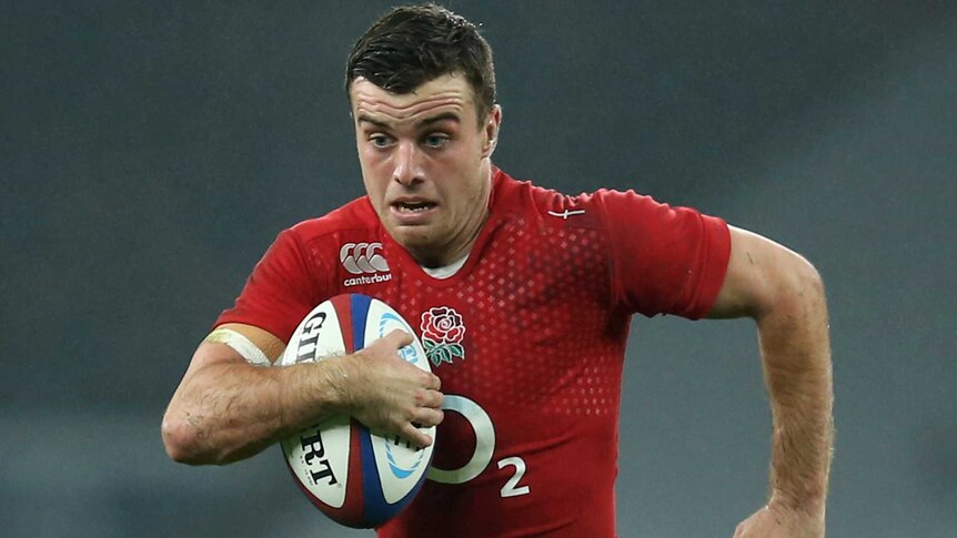 England's George Ford runs the ball