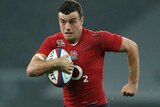 England's George Ford runs the ball