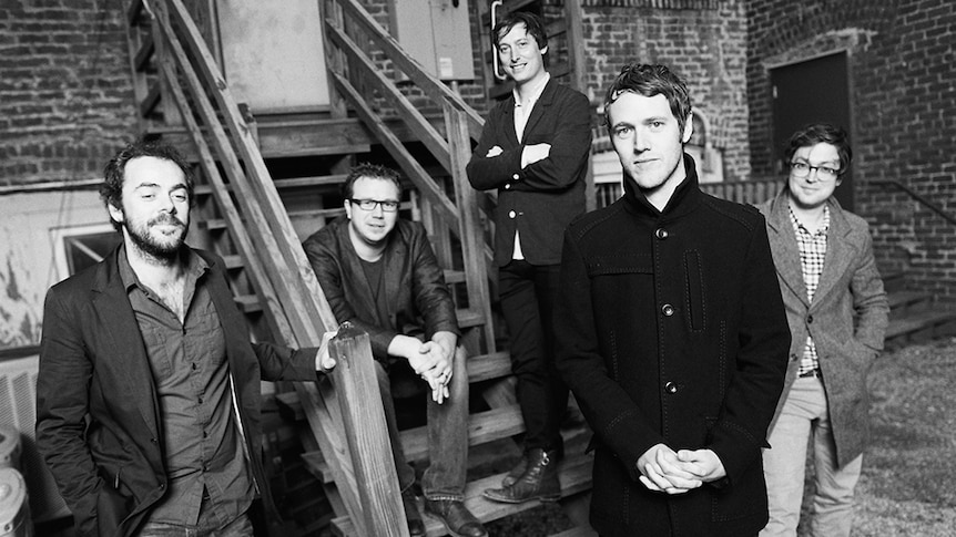 Black and white photo of British five-piece band Gomez