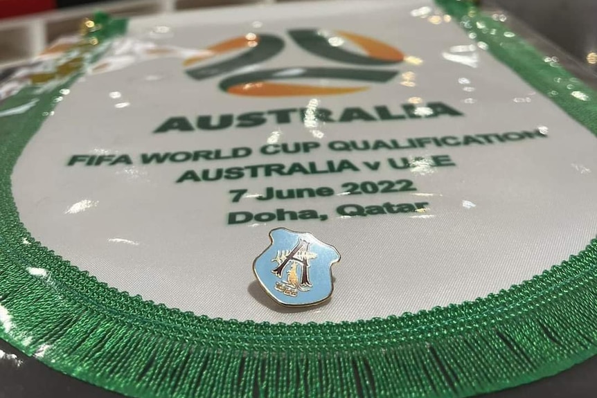 A badge and banner for an Australian national soccer team before a big match