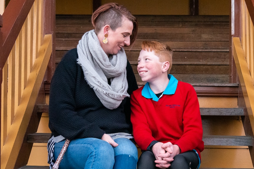 Mother and son sitting together