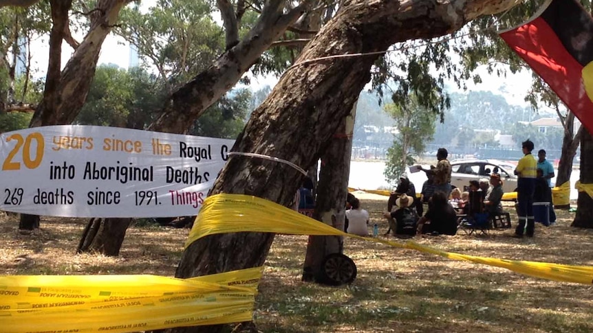 Tent camp and signs on Heirisson Island