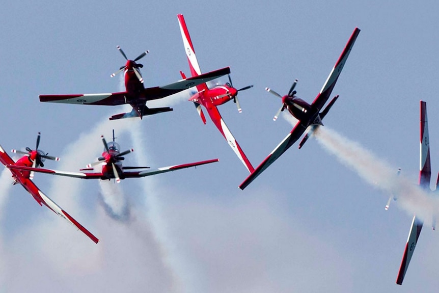 Roulettes aircraft spin through the air.