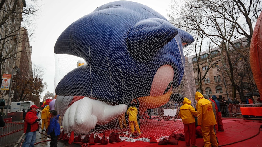 Workers prepare Sonic balloon for parade