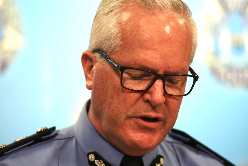 WA police commissioner Chris Dawson looks down.