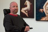 Andrew Grant with his figure paintings