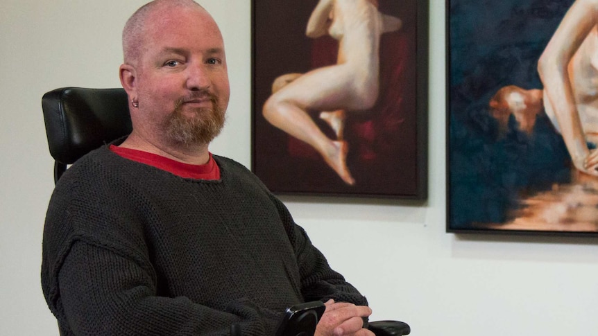 Andrew Grant with his figure paintings